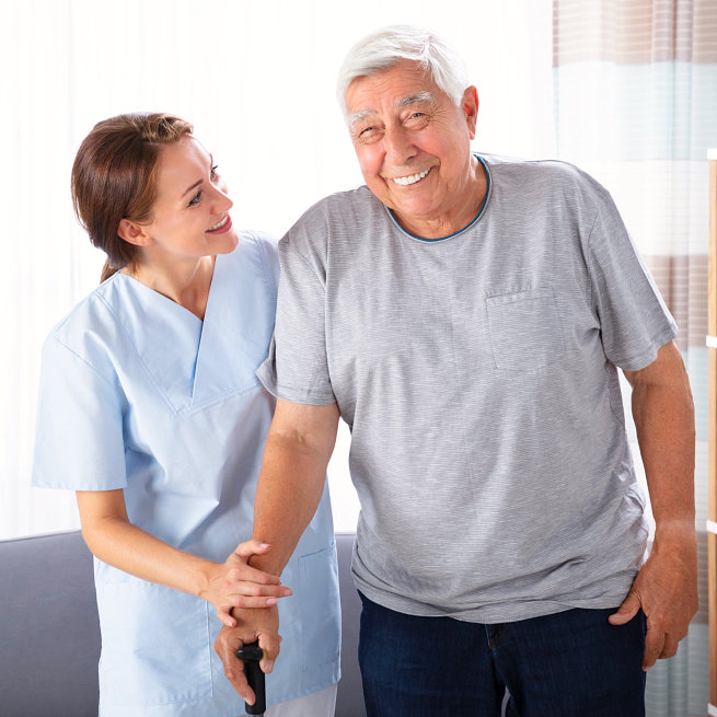 caregiver assisting her patient