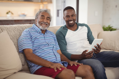 man and senior man smiling