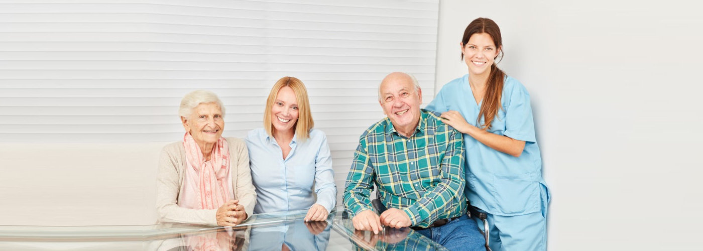 caregivers along with their patients smiling