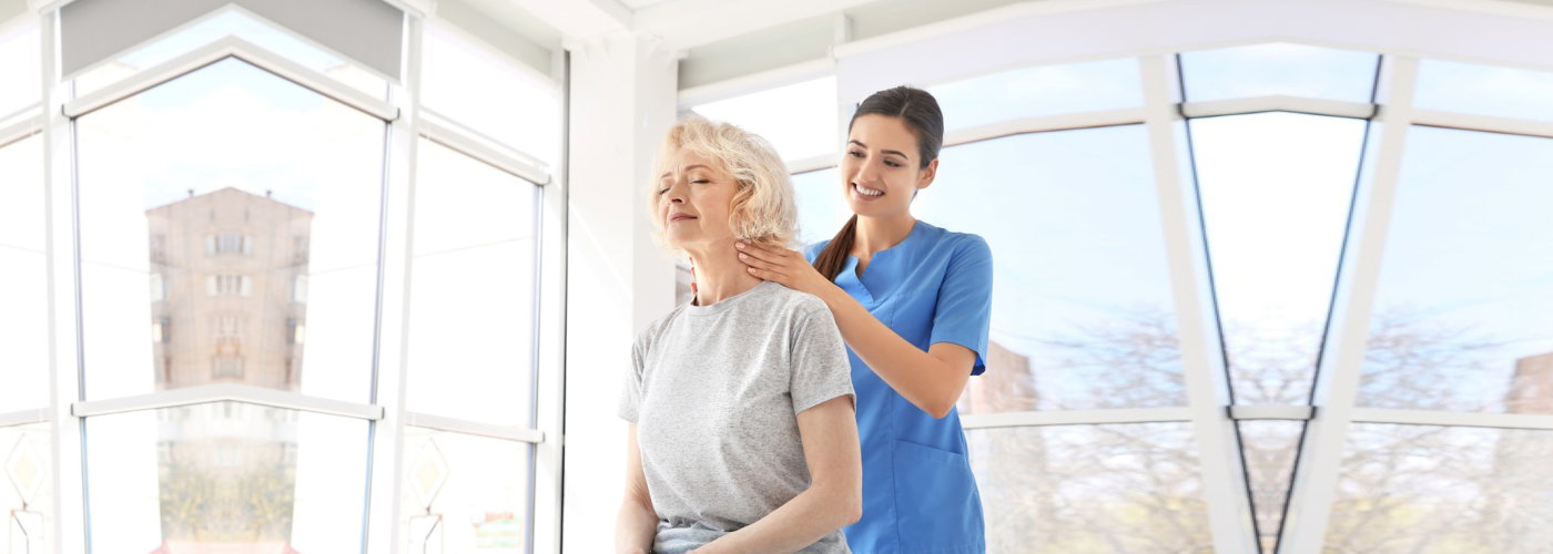 caregiver massaging her patient